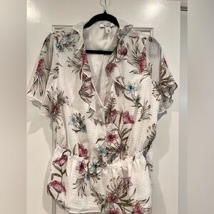 Floral top with sheer sleeves.